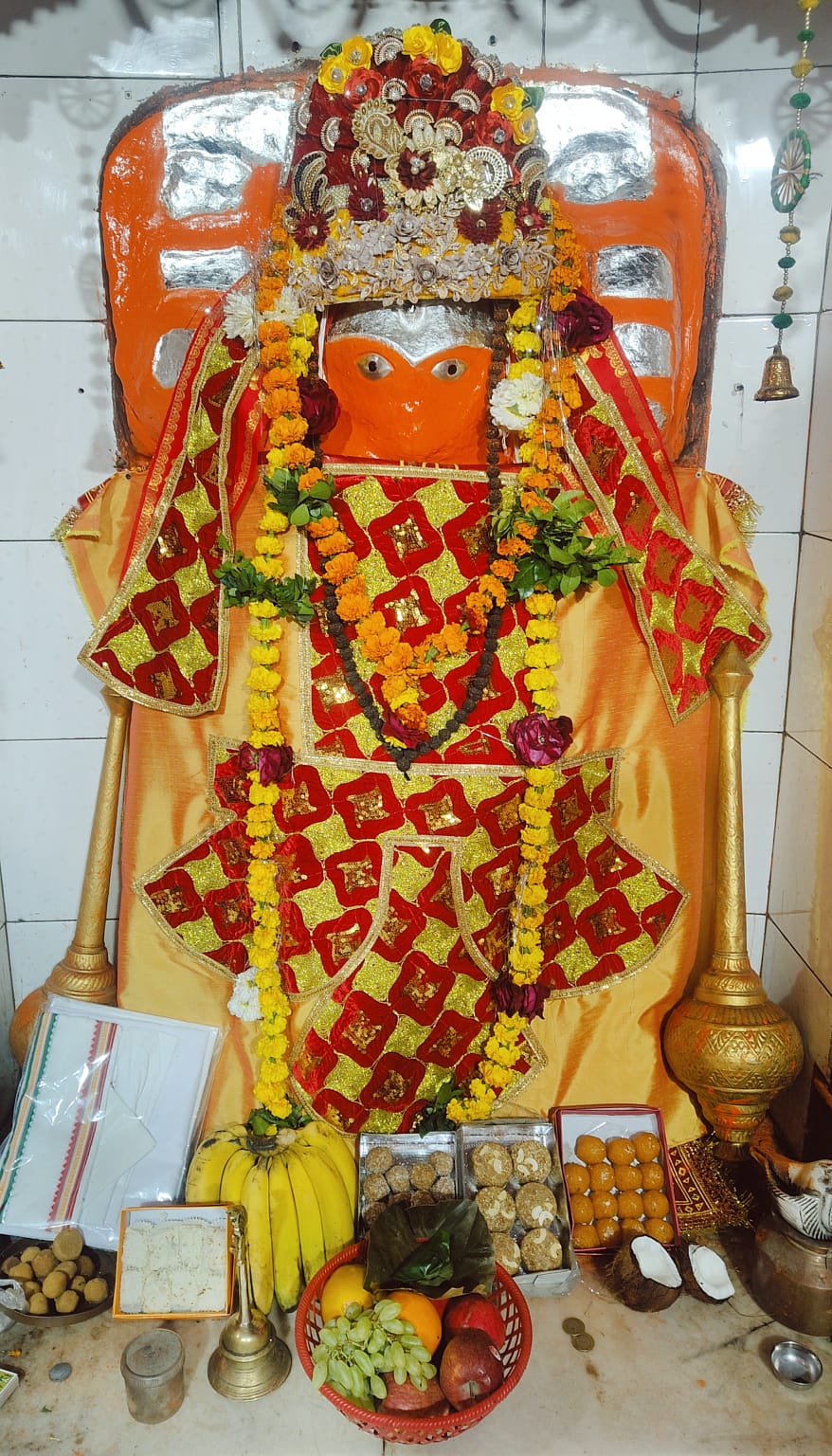 Baba with grand mukut and bhog offerings